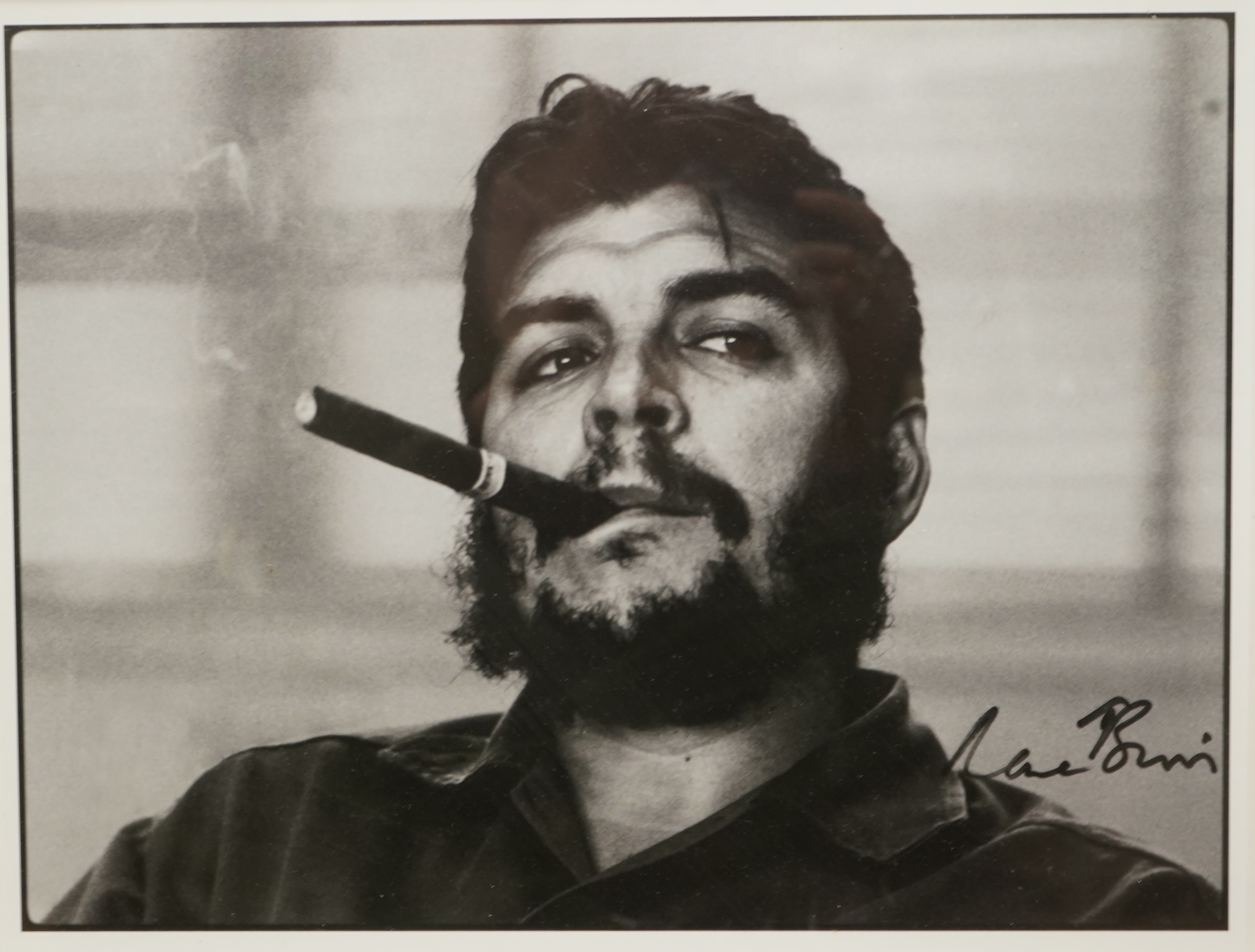 After Rene Burri (1933-2014), ‘Che Guevara smoking a cigar’, facsimile signature, gelatin silver print, 25 x 32cm